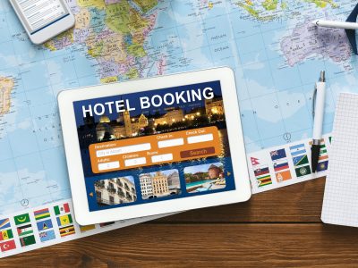Tablet With Hotel Booking Application Lying On Desk, Collage, Above-View Tablet With Hotel Booking Application Lying On Desk, Collage, Above-View
